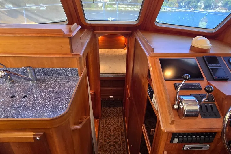 Slide: The Image of Interior of a 2004 Sabre 36 yacht with helm and galley area. - 37