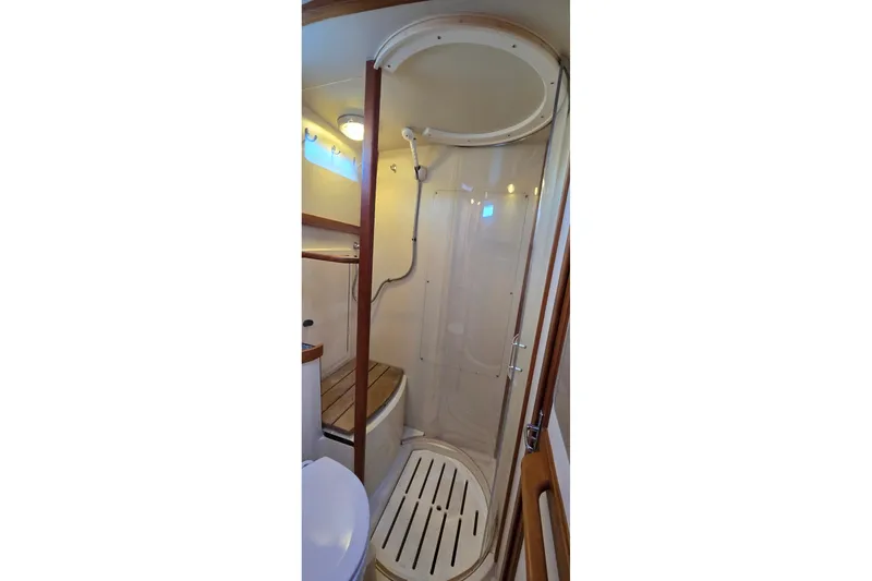 Slide: The Image of Shower area in 2004 Sabre 36 yacht with wooden accents and modern fixtures. - 49