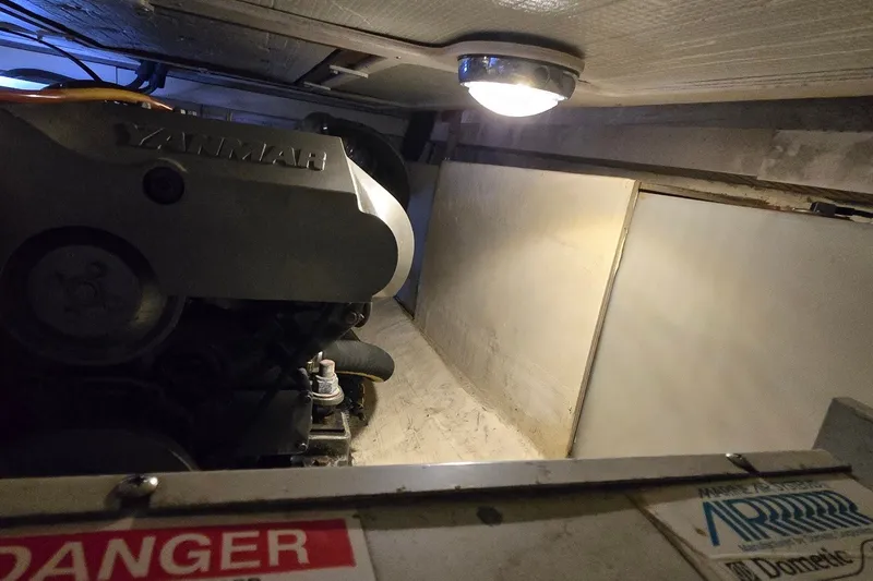 Slide: The Image of Engine room of a 2004 Sabre 36 boat with Yanmar engine under lighting. - 57