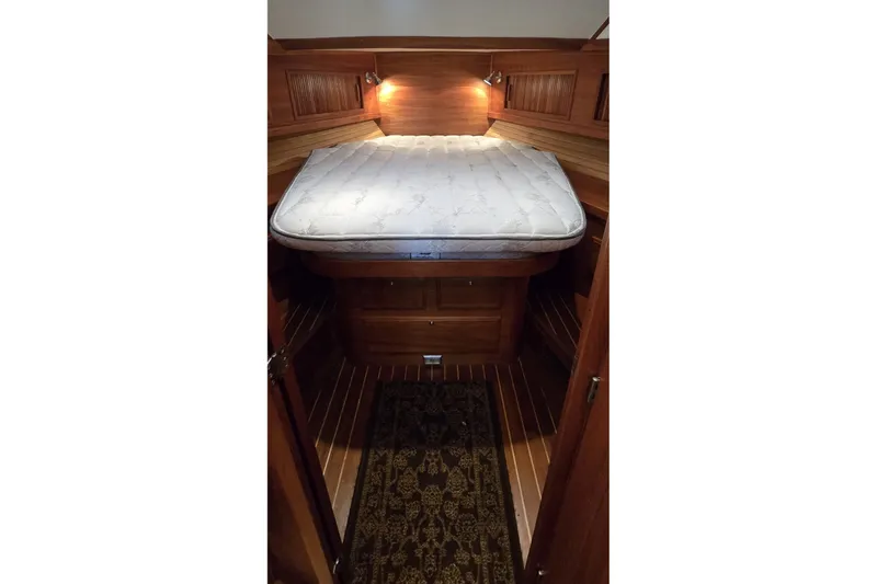 Slide: The Image of Cozy cabin interior of 2004 Sabre 36 yacht with wooden finish and mattress. - 40