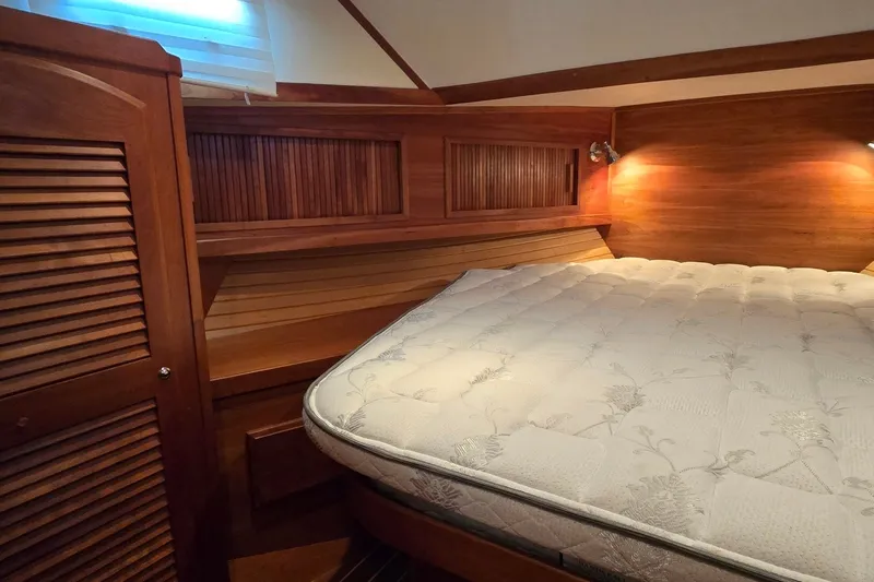 Slide: The Image of Luxurious wooden cabin interior of 2004 Sabre 36 yacht with cozy bed. - 42