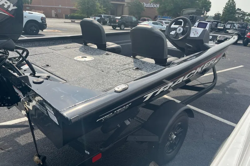 Slide: The Image of 2026 Tracker Pro Team 175 Crappie Edition boat in parking lot, showcasing sleek design. - 4