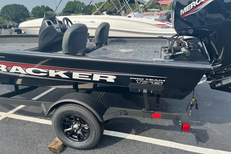 Slide: The Image of 2026 Tracker Pro Team 175 Crappie Edition boat on trailer in parking lot. - 2