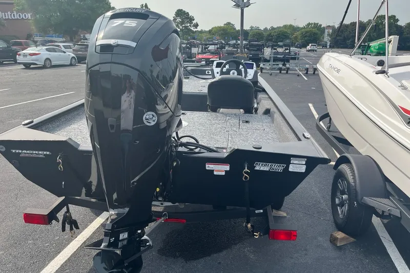 Slide: The Image of 2026 Tracker Pro Team 175 Crappie Edition boat with Mercury 75 engine in parking lot. - 3