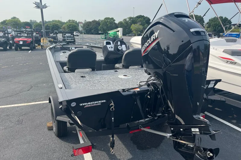 Slide: The Image of 2026 Tracker Pro Team 175 Crappie Edition boat with Mercury engine in parking lot. - 55