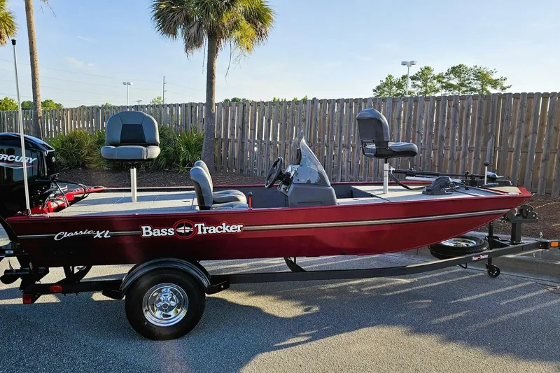 The Image of 2026 Tracker Bass Tracker Classic XL boat on trailer, parked outdoors. - 0