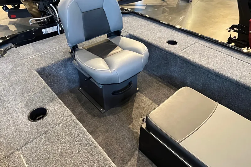 Slide: The Image of 2026 Tracker Panfish 17 boat interior with gray seating and carpeted flooring. - 15