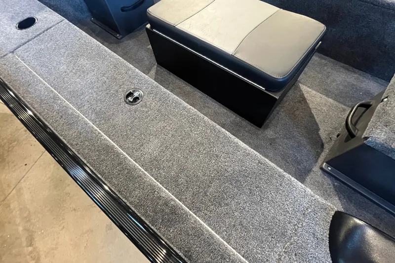Slide: The Image of Interior of 2026 Tracker Panfish 17 boat with gray carpet and seating. - 20