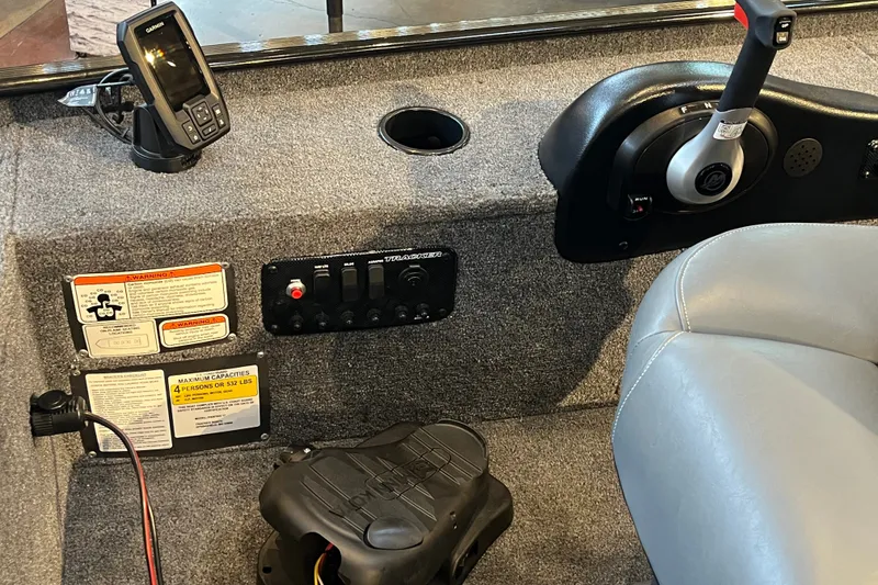 Slide: The Image of Interior of 2026 Tracker Panfish 17 boat with control panel and seating. - 14