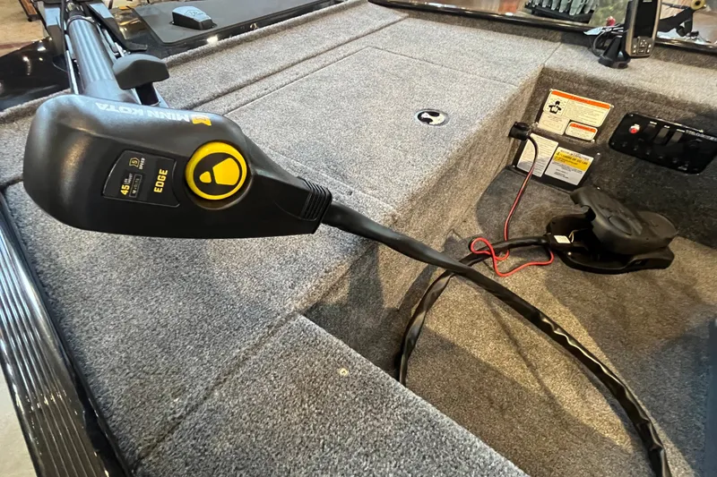 Slide: The Image of 2026 Tracker Panfish 17 boat interior with Minn Kota trolling motor and control panel. - 13