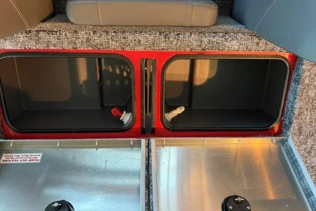 Slide: The Image of Storage compartments in a 2026 Tracker Pro Team 195 boat interior. - 13