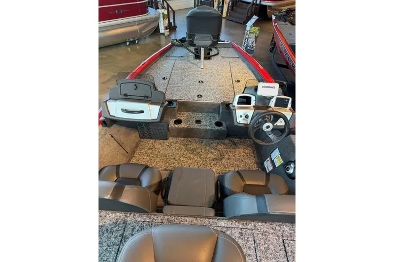 Slide: The Image of 2026 Tracker Pro Team 195 boat interior with steering wheel and seating. - 6