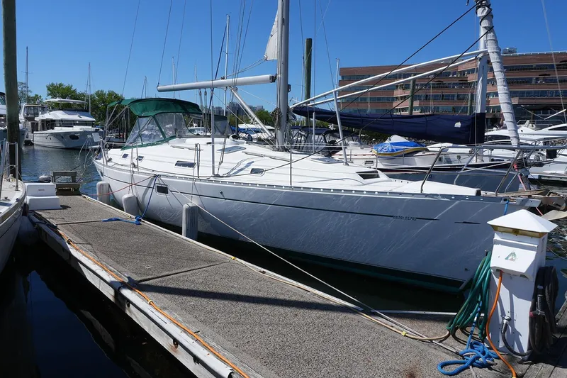 Slide: The Image of Sailboat docked at marina, 1999 Beneteau 381, clear blue sky background. - 2