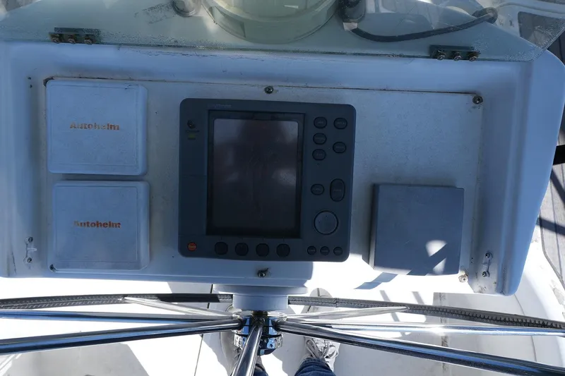 Slide: The Image of Control panel of a 1999 Beneteau 381 sailboat with navigation instruments. - 30