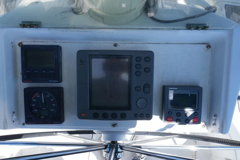 Slide: The Image of Control panel of a 1999 Beneteau 381 sailboat with navigation instruments. - 31