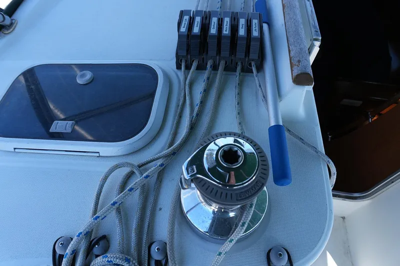 Slide: The Image of Deck of 1999 Beneteau 381 sailboat with winch, ropes, and cleats. - 7