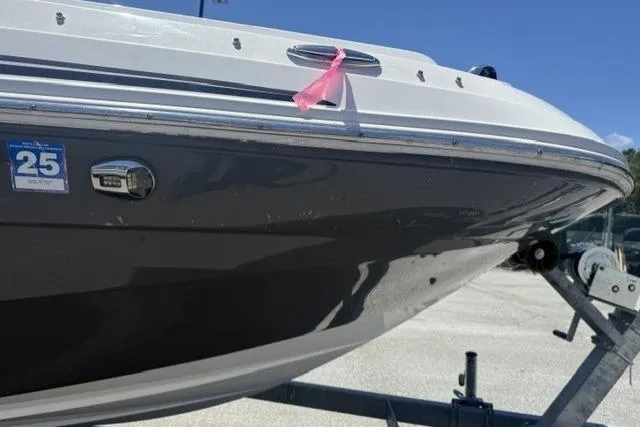 Slide: The Image of 2021 Hurricane SunDeck Sport 205 OB boat on trailer, featuring sleek design and modern detailing. - 3