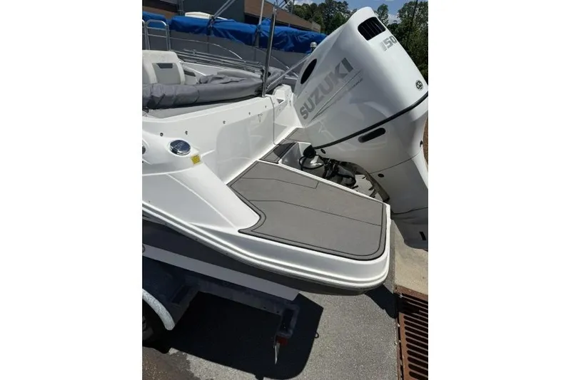 Slide: The Image of 2021 Hurricane SunDeck Sport 205 OB boat with Suzuki outboard motor. - 5