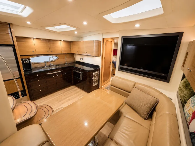 Slide: The Image of Interior of the 2011 Formula 45 Yacht with modern kitchen and cozy living area. - 4