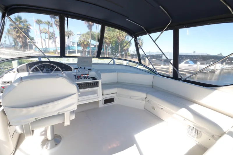 Slide: The Image of 1999 Bayliner 3988 Command Bridge Motoryacht interior with helm and seating area. - 10