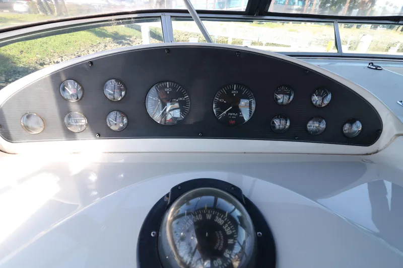 Slide: The Image of Instrument panel of a 1999 Bayliner 3988 Command Bridge Motoryacht with compass and gauges. - 14