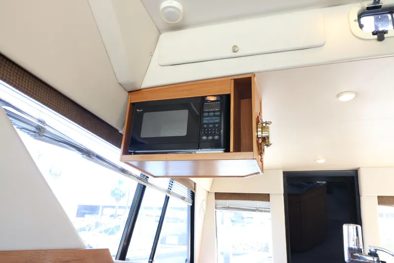 Slide: The Image of Microwave in 1999 Bayliner 3988 Command Bridge Motoryacht interior kitchen area. - 31
