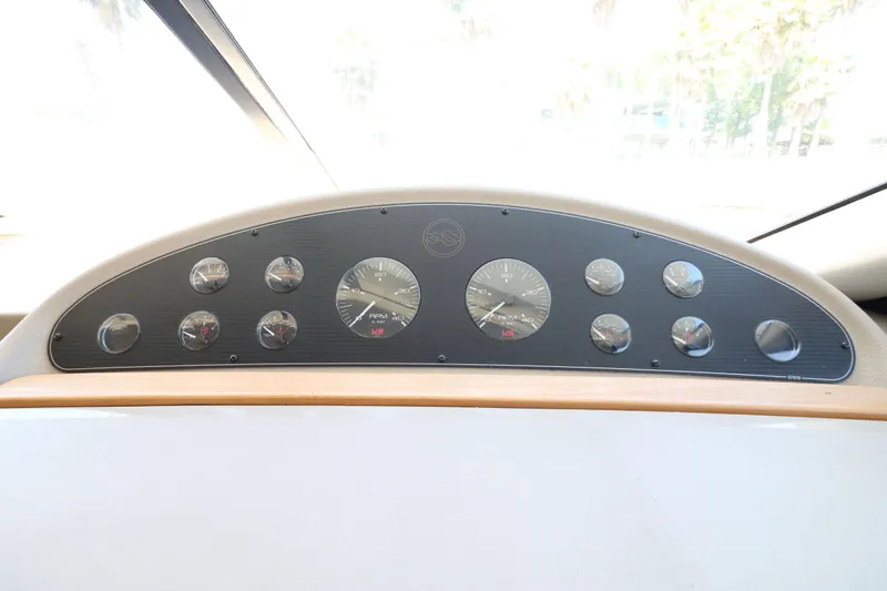 Slide: The Image of Dashboard of 1999 Bayliner 3988 Command Bridge Motoryacht with multiple gauges and instruments. - 35