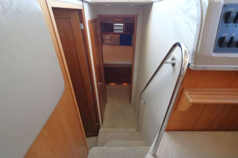 Slide: The Image of Interior view of 1999 Bayliner 3988 Command Bridge Motoryacht, featuring stairs and cabin entrance. - 37