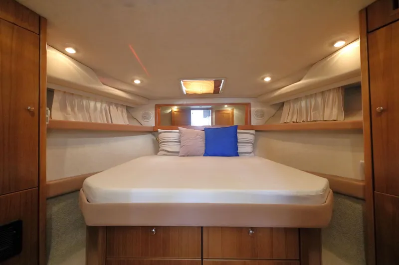 Slide: The Image of Luxurious cabin interior of 1999 Bayliner 3988 Command Bridge Motoryacht with cozy bedding. - 38