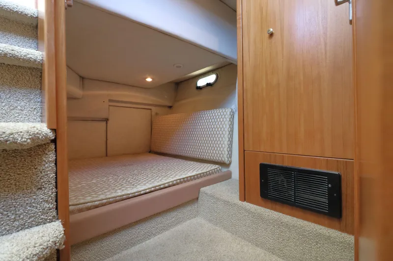 Slide: The Image of Cozy cabin interior of 1999 Bayliner 3988 Command Bridge Motoryacht with carpeted stairs. - 47