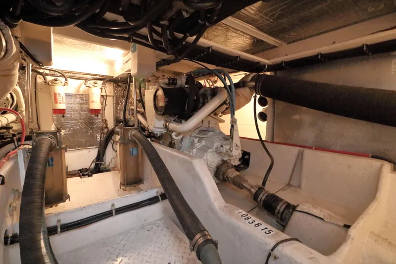 Slide: The Image of Engine room of 1999 Bayliner 3988 Command Bridge Motoryacht, showcasing mechanical components. - 50