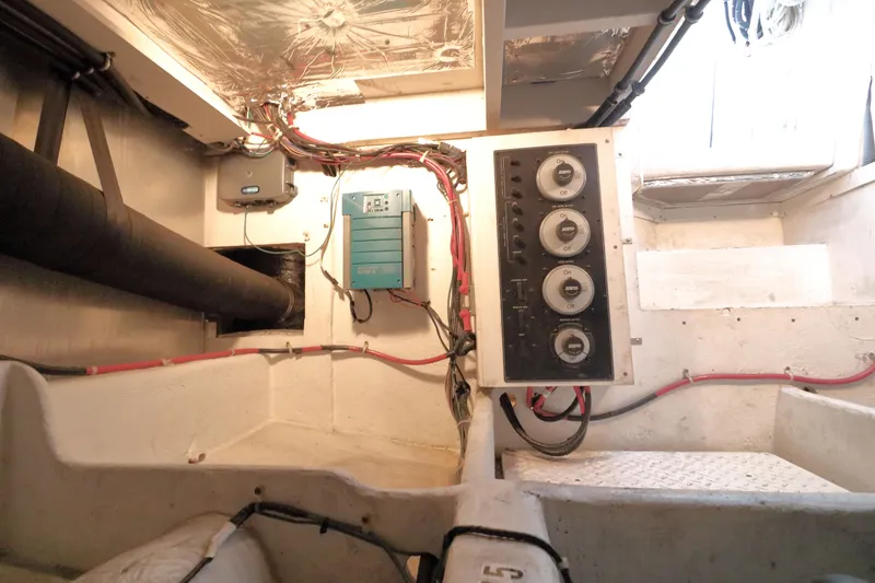 Slide: The Image of Engine room of 1999 Bayliner 3988 Command Bridge Motoryacht with control panel and wiring. - 54
