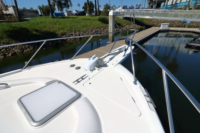 Slide: The Image of Bow view of 1999 Bayliner 3988 Command Bridge Motoryacht docked at marina. - 8