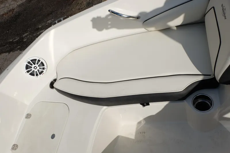 Slide: The Image of 2020 Stingray 191 DC boat interior with white seating and speaker detail. - 10