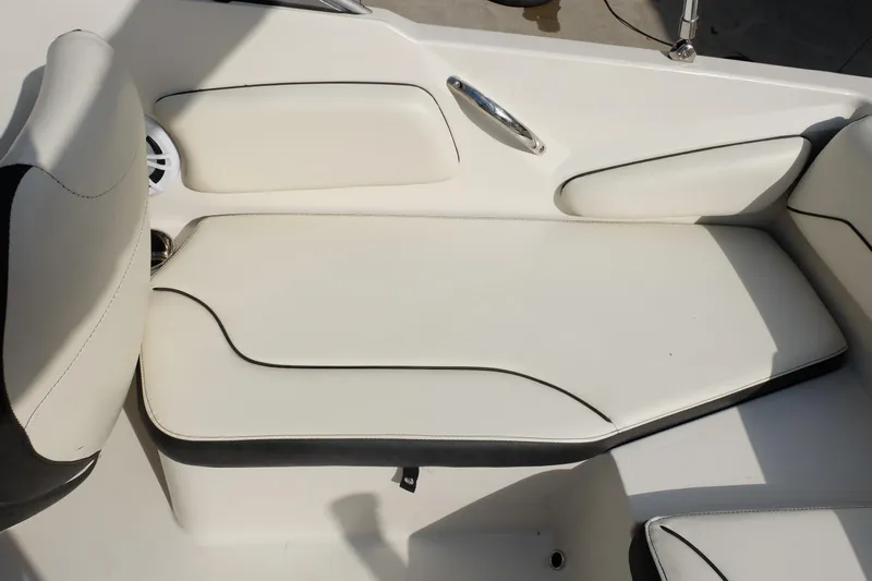 Slide: The Image of 2020 Stingray 191 DC boat interior with white cushioned seating and sleek design. - 20