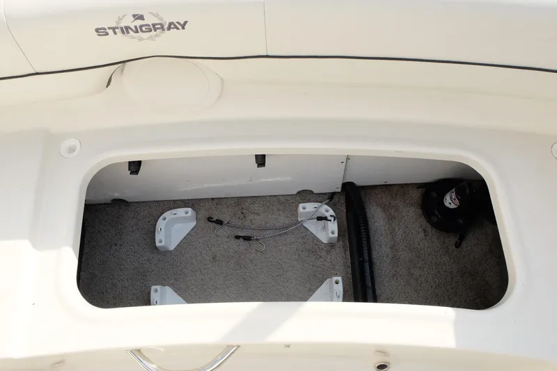 Slide: The Image of Open storage compartment in a 2020 Stingray 191 DC boat. - 23