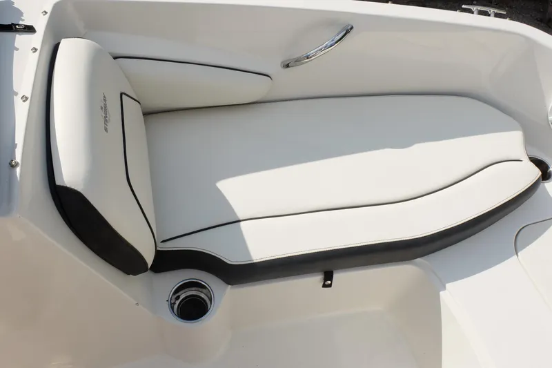 Slide: The Image of 2020 Stingray 191 DC boat interior with white cushioned seating and chrome handle. - 6