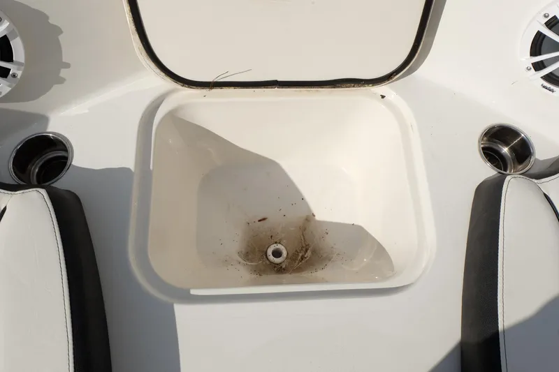 Slide: The Image of Open storage compartment on a 2020 Stingray 191 DC boat, showing interior details. - 9