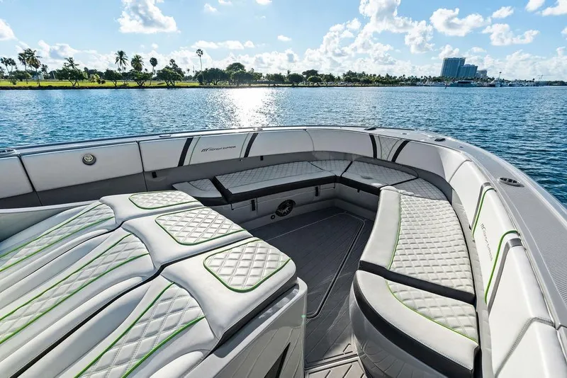 Slide: The Image of Luxurious seating on 2022 Midnight Express 43' Solstice boat, with scenic waterfront view. - 27