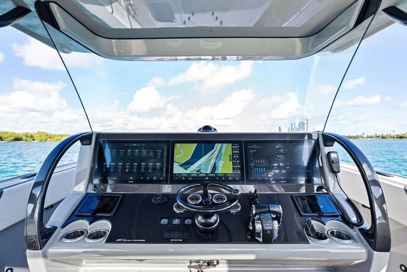 Slide: The Image of Cockpit of 2022 Midnight Express 43' Solstice boat with advanced navigation displays. - 38
