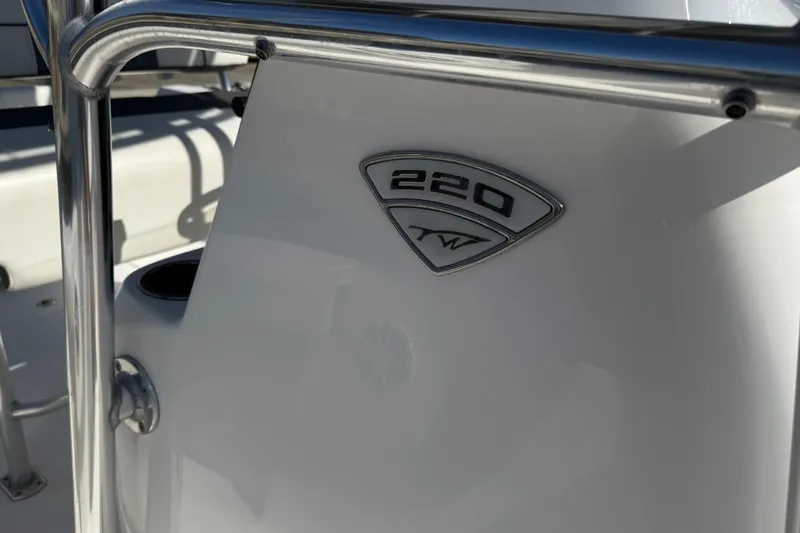 Slide: The Image of 2017 Tidewater 220 CC Adventure boat emblem and railing detail. - 17