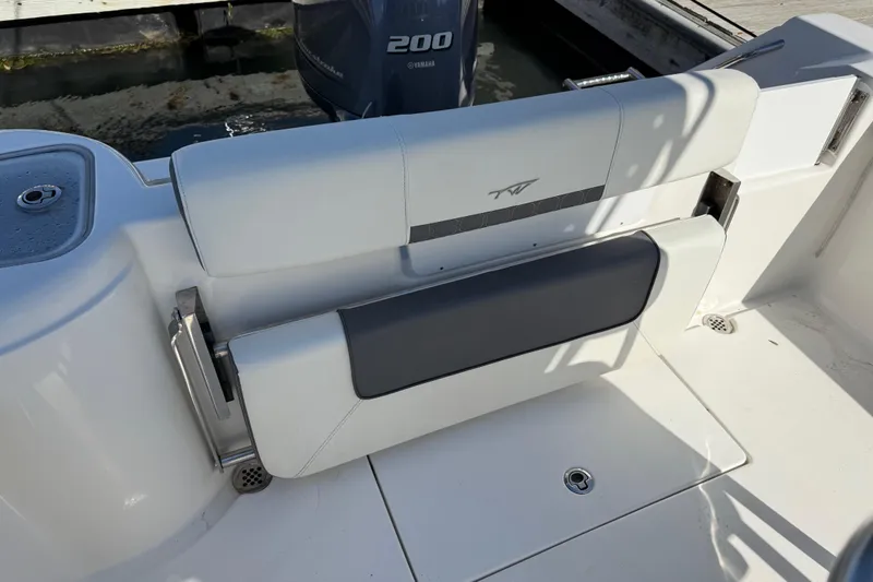 Slide: The Image of 2017 Tidewater 220 CC Adventure boat seat with Yamaha 200 engine in background. - 32