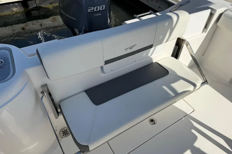 Slide: The Image of 2017 Tidewater 220 CC Adventure boat seat with Yamaha 200 engine in background. - 33