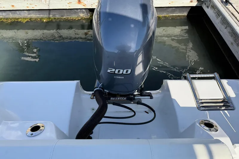 Slide: The Image of 2017 Tidewater 220 CC Adventure boat with Yamaha 200 engine at dock. - 35
