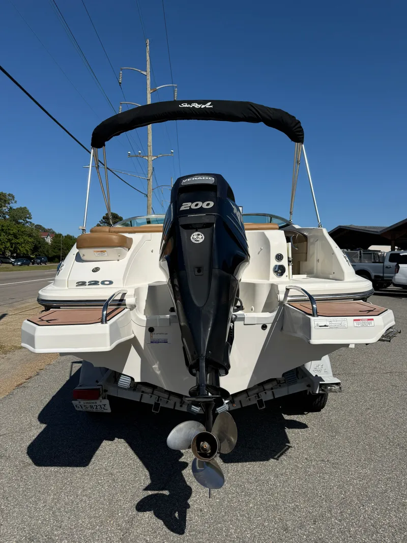 Slide: The Image of 2015 Sea Ray 220 Sundeck OB with outboard motor. - 1
