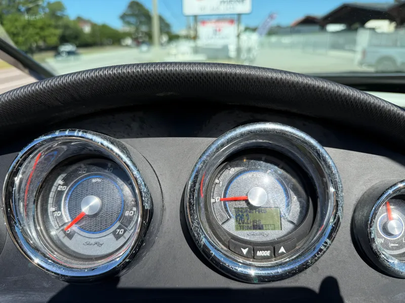 Slide: The Image of Dashboard of a 2015 Sea Ray 220 Sundeck OB boat. - 10