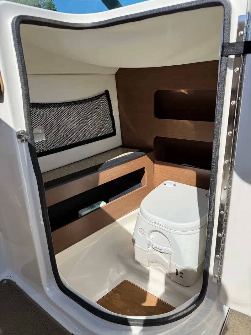 Slide: The Image of Interior of 2015 Sea Ray 220 Sundeck OB with toilet. - 11