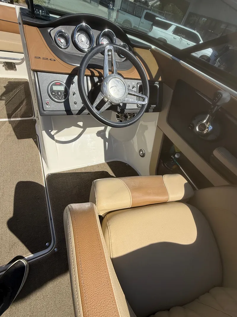 Slide: The Image of Interior of a 2015 Sea Ray 220 Sundeck OB boat. - 9