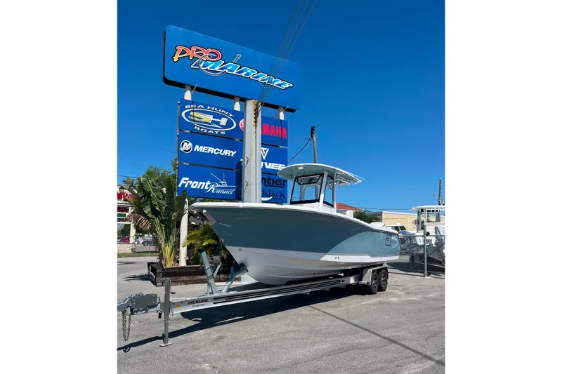 Slide: The Image of 2026 Sea Hunt Ultra 275 Coffin Box boat on trailer at dealership. - 1