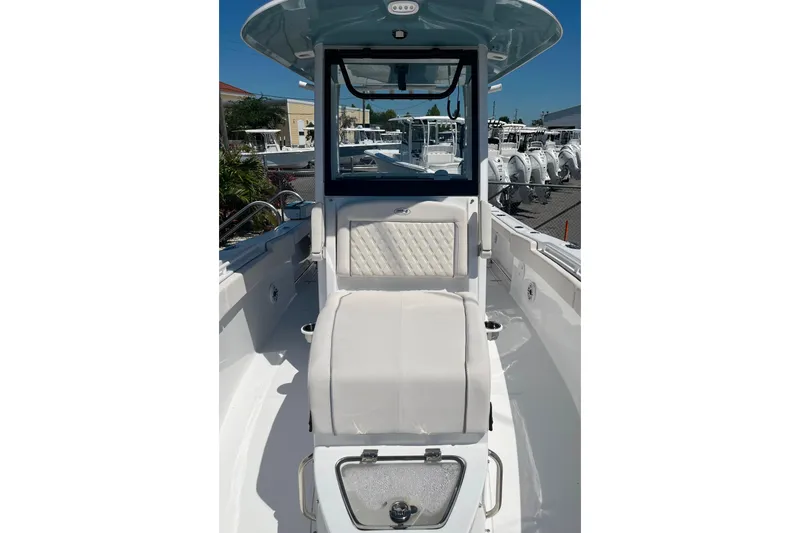 Slide: The Image of 2026 Sea Hunt Ultra 275 Coffin Box boat interior with cushioned seating and sleek design. - 11